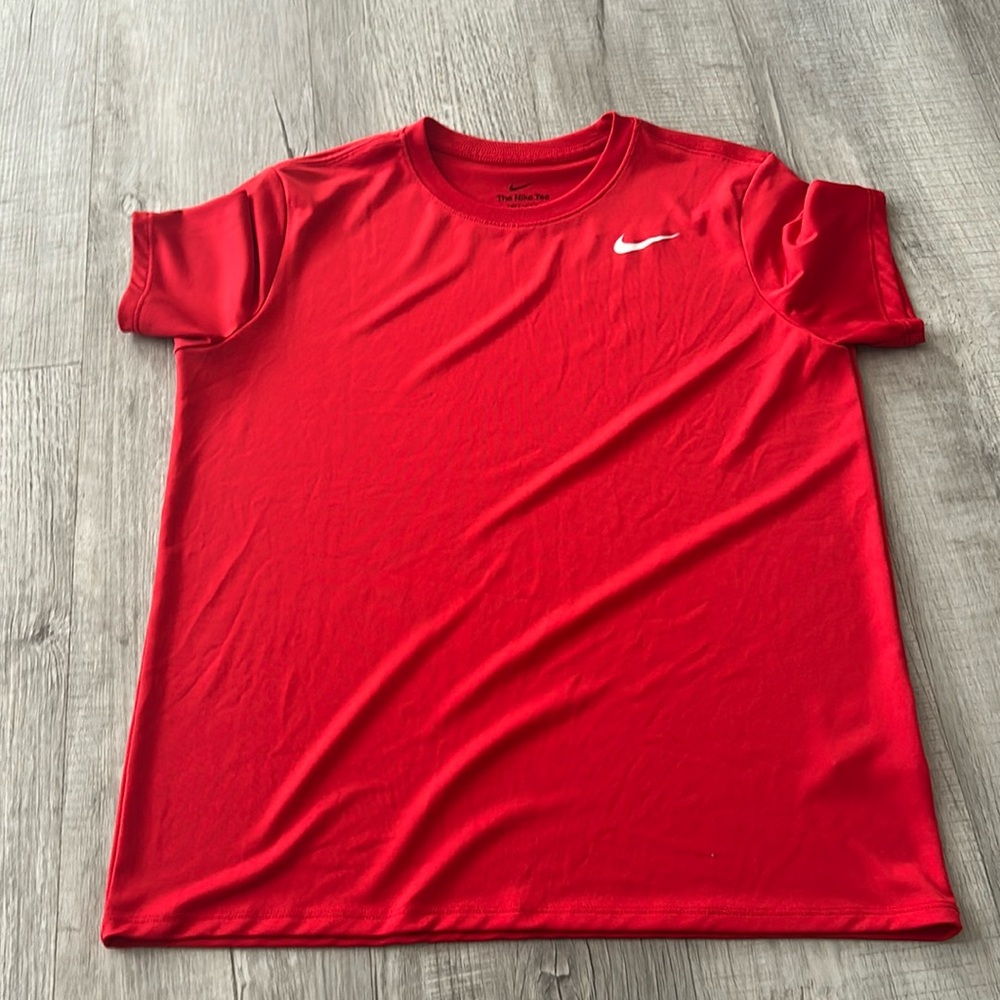 Red Nike tee.